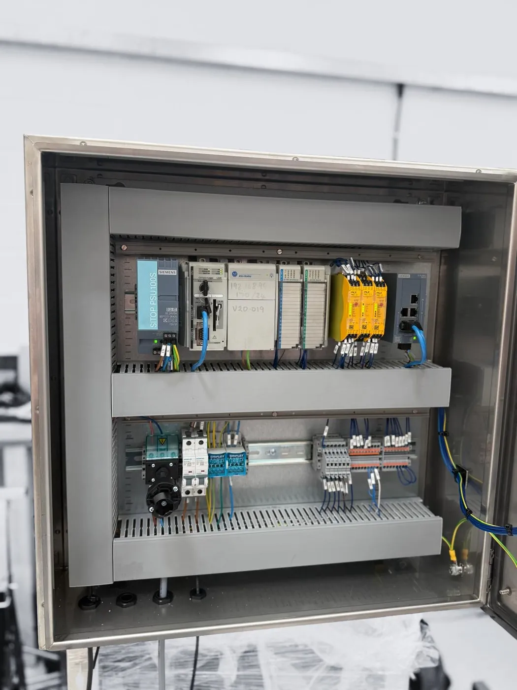 ECS-built control panel with Siemens and Allen-Bradley hardware in a stainless enclosure